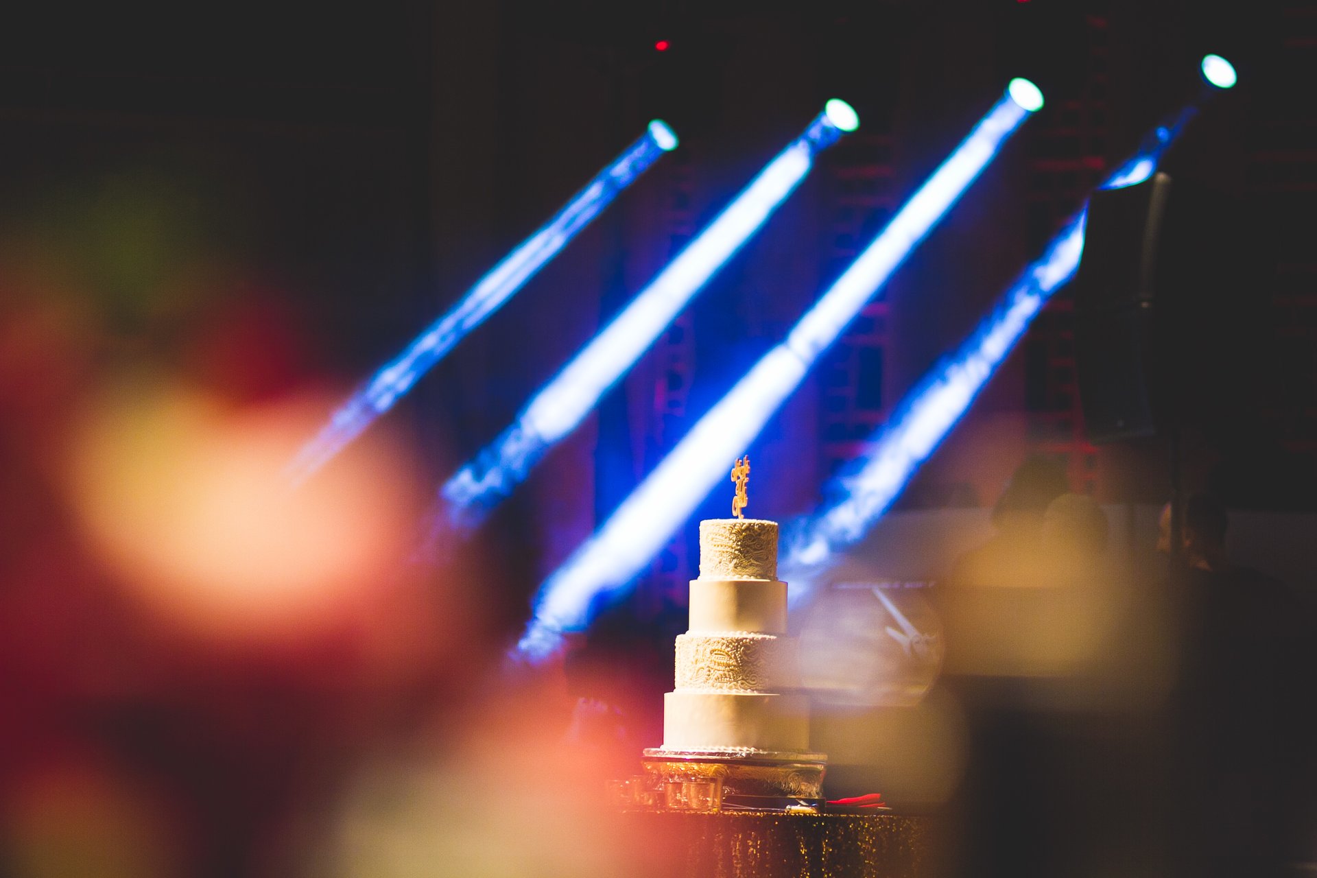 Event lighting and cake at a DJ Hinda reception